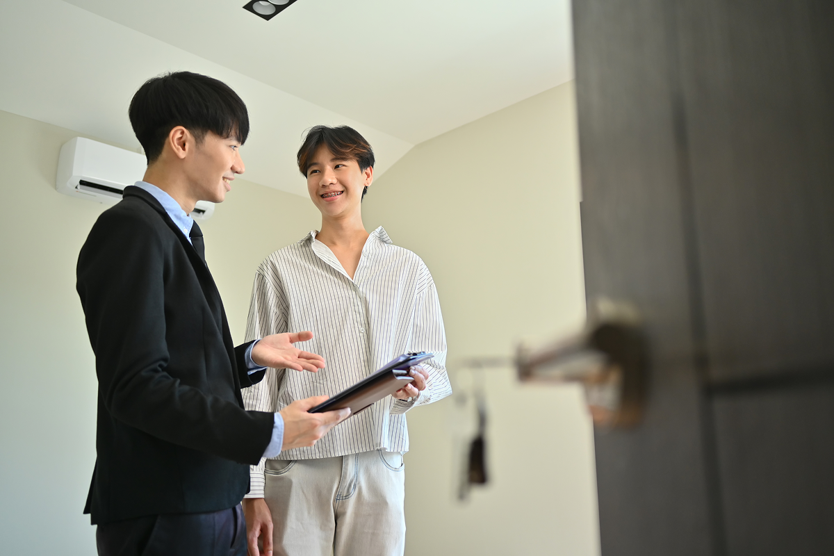 Renters and an agent looking through application documents